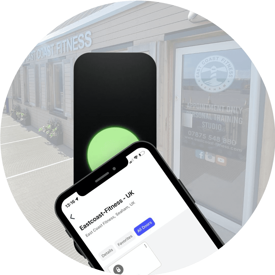 Smartphone showing access to East Coast Fitness with a green light indicator, in front of the gym's entrance.